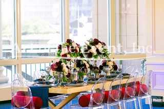 zoom out shot of full table setting with floral centerpieces