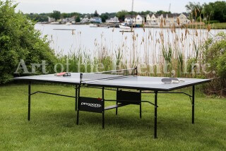 ping pong table along the water
