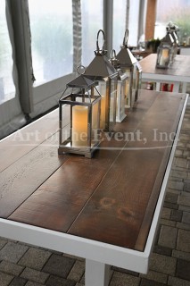 wooden table with lanterns on top