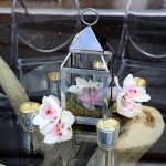 Floral and candle table centerpieces