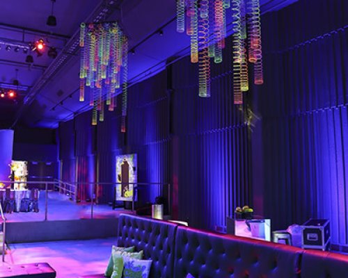 couch area of neon themed party room