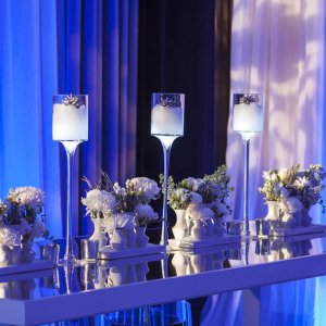 Glass table with candle centerpiece